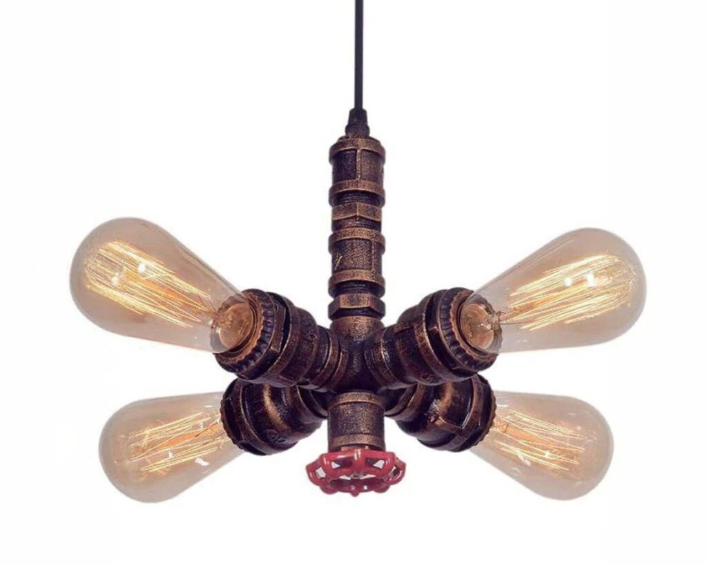 Suspension métal vintage à 4 têtes sur fond blanc.