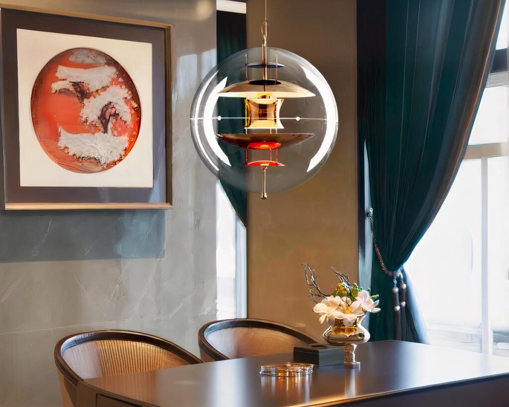 Suspension globe élégante et moderne au design innovant allumée dans une salle à manger au-dessus d'une table