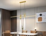Suspension moderne LED double et dorée en aluminium au-dessus d'une table