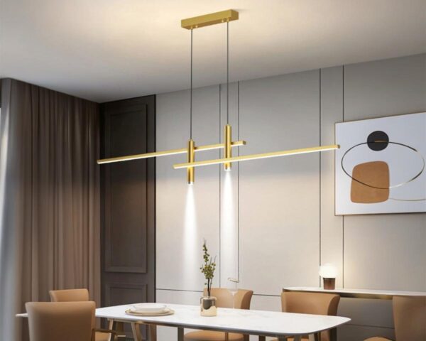 Suspension moderne LED double et dorée en aluminium au-dessus d'une table