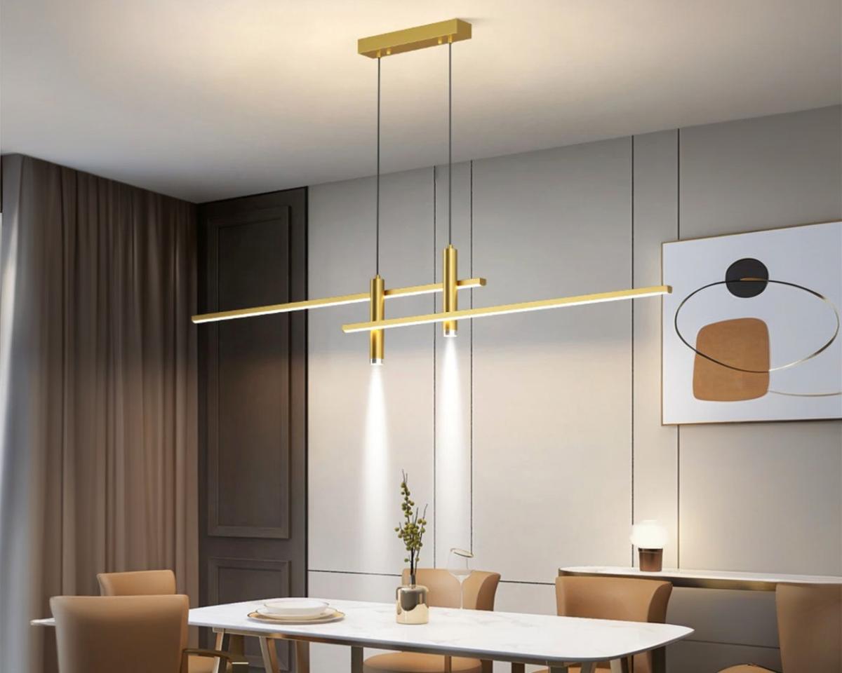 Suspension moderne LED double et dorée en aluminium au-dessus d'une table