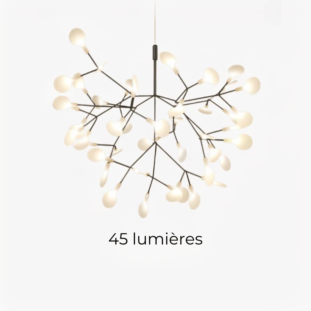 Une suspension LED à branches florales design contemporain avec des petites lumières en forme de feuilles, suspendue sur fond sombre.